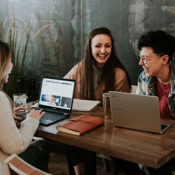 stock photo of people meeting with laptops